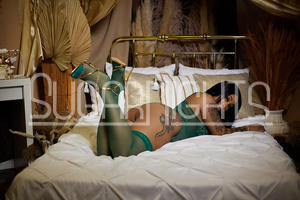Noelle Kemper in green stockings posing on bed Noelle Kemper in green stockings posing on bed